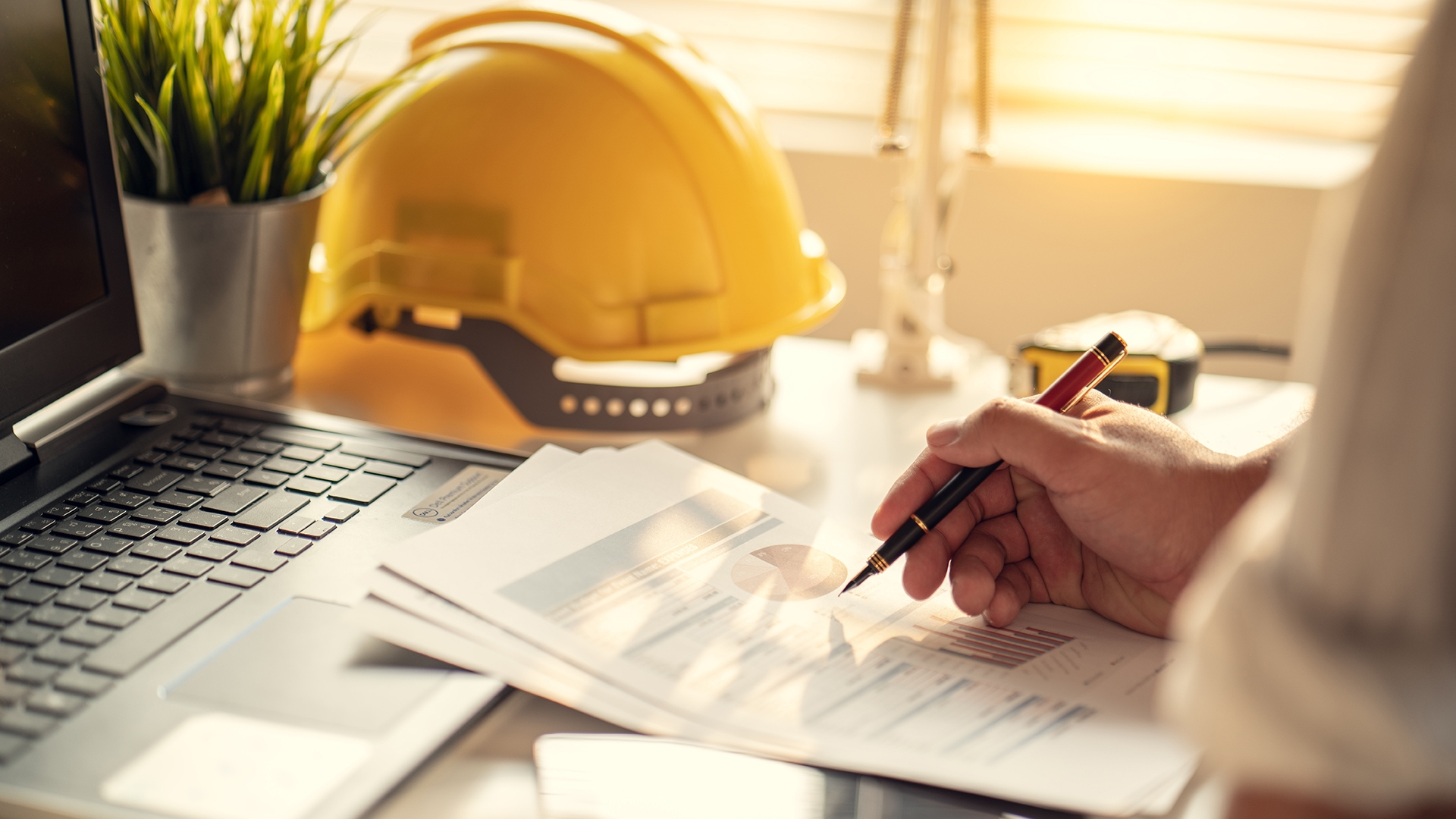 hard hat and loan paperwork